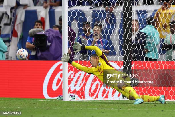 Shuichi Gonda of Japan dives for the Croatia's third penalty taken by Marko Livaja of Croatia during the FIFA World Cup Qatar 2022 Round of 16 match...