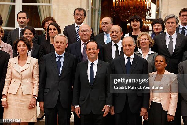 French President Francois Hollande , Prime Minister Jean-Marc Ayrault and Foreign Minister Laurent Fabius pose with the new cabinet after the first...