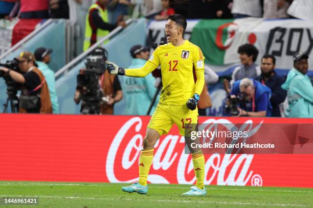 Shuichi Gonda of Japan celebrates after the Croatia's third penalty taken by Marko Livaja hitting a post during the FIFA World Cup Qatar 2022 Round...