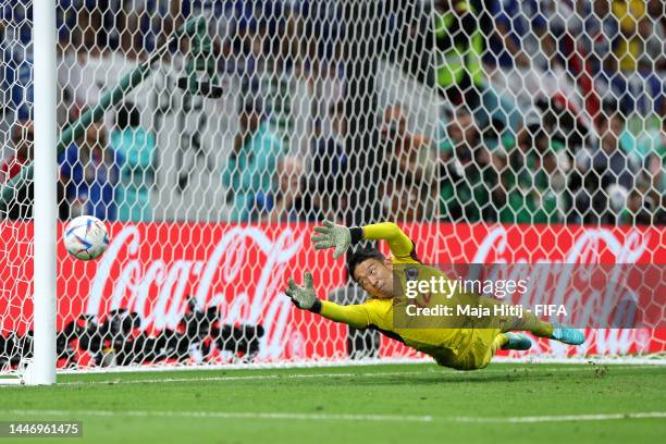 Shuichi Gonda of Japan dives for the Croatia's third penalty taken by Marko Livaja of Croatia during the FIFA World Cup Qatar 2022 Round of 16 match...