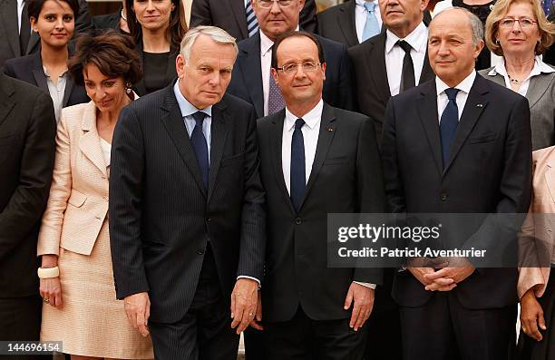 French President Francois Hollande , Prime Minister Jean-Marc Ayrault and Foreign Minister Laurent Fabius pose with the new cabinet after the first...