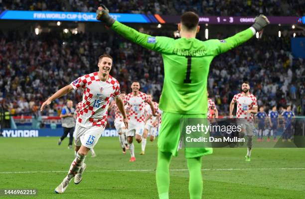 Mario Pasalic and Dominik Livakovic of Croatia celebrate after winning the penalty shoot out during the FIFA World Cup Qatar 2022 Round of 16 match...