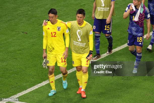 Shuichi Gonda and Eiji Kawashima of Japan react after the penalty shoot out loss during the FIFA World Cup Qatar 2022 Round of 16 match between Japan...