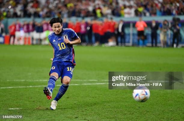 Takumi Minamino of Japan shoots the team's first penalty saved by Dominik Livakovic of Croatia in the penalty shoot out during the FIFA World Cup...