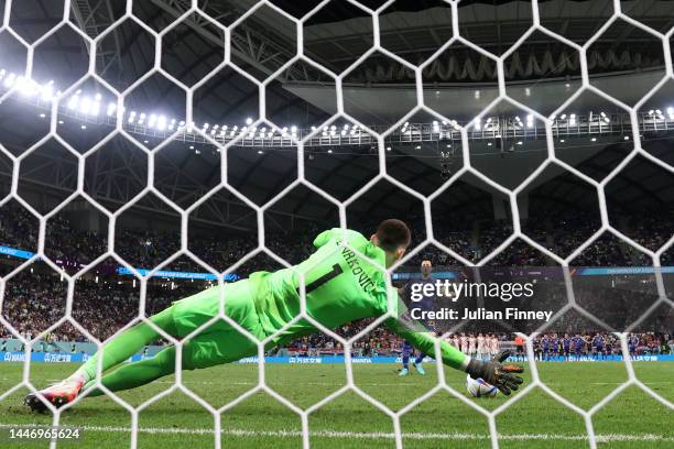 Dominik Livakovic of Croatia saves the fourth penalty by Maya Yoshida of Japan in the penalty shoot out during the FIFA World Cup Qatar 2022 Round of...