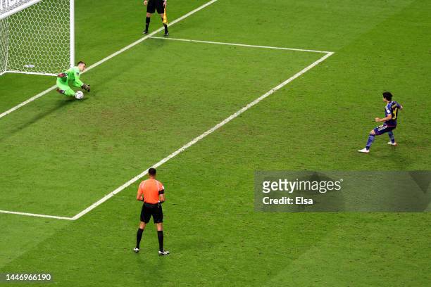 Dominik Livakovic of Croatia saves the first penalty from Takumi Minamino of Japan in the penalty shoot out during the FIFA World Cup Qatar 2022...