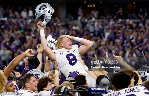 Ty Zentner of the Kansas State Wildcats is carried away by teammates after kicking the game winning field goal in overtime against the TCU Horned...
