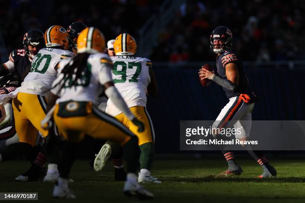 Justin Fields of the Chicago Bears looks to pass against the Green Bay Packers at Soldier Field on December 04, 2022 in Chicago, Illinois.