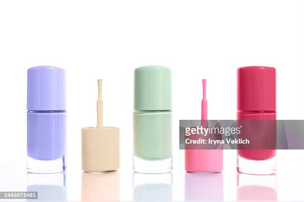collection nail polish in trendy pastel rainbow colors on white background. concept color of the year 2023 viva magenta pink  purple red. - nail polish stockfoto's en -beelden