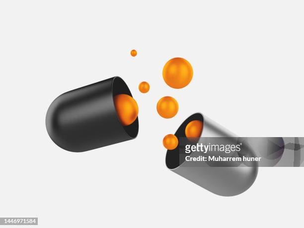 3d illustration related to medicines use. orange circles coming out of the pill capsule. - capsule stock illustrations
