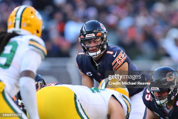 Justin Fields of the Chicago Bears looks on under center against the Green Bay Packers at Soldier Field on December 04, 2022 in Chicago, Illinois.