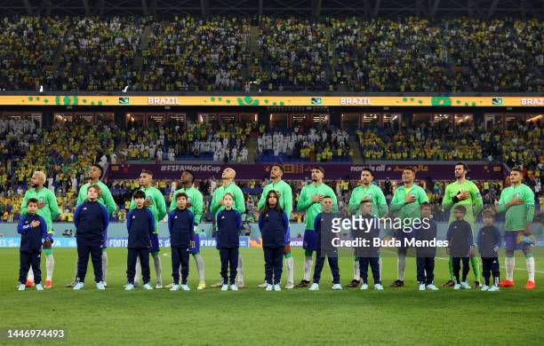 Brazil players line up for the national anthem prior to the FIFA World Cup Qatar 2022 Round of 16 match between Brazil and South Korea at Stadium 974...