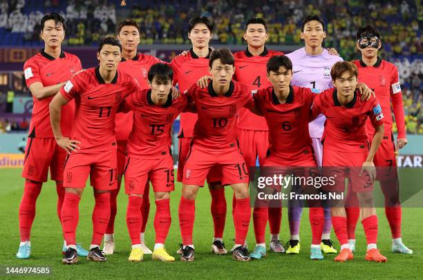 Korea Republic players line up for the national anthem prior to the FIFA World Cup Qatar 2022 Round of 16 match between Brazil and South Korea at...