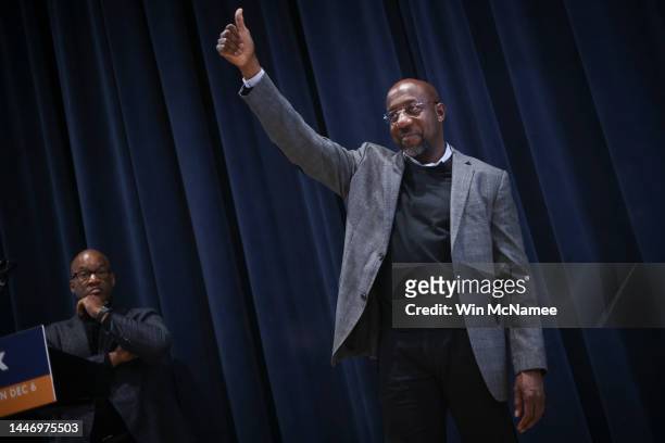 Georgia Democratic Senate candidate U.S. Sen. Raphael Warnock gives a thumbs up to supporters after speaking at a Students for Warnock rally at...