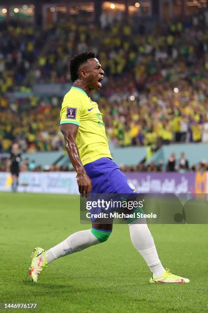 Vinicius Junior of Brazil celebrates after scoring the team's first goal during the FIFA World Cup Qatar 2022 Round of 16 match between Brazil and...