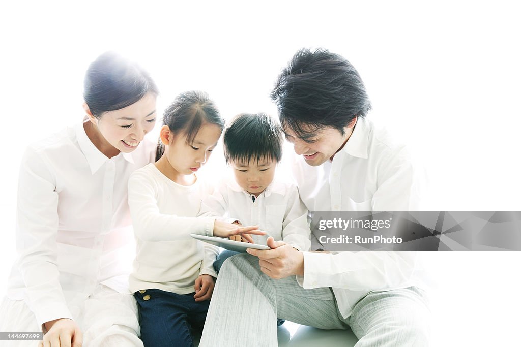 Family enjoying tablet computer