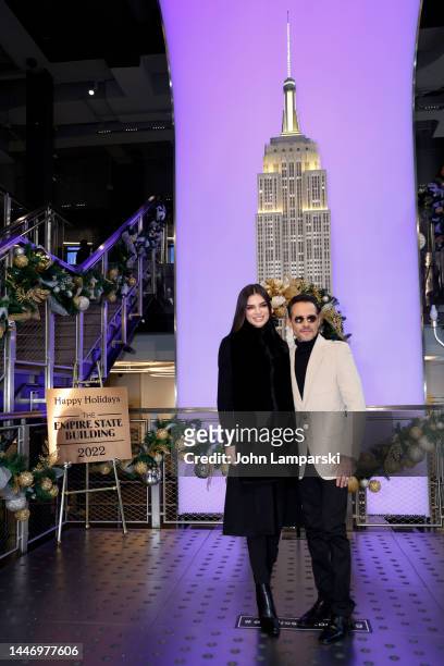 Nadia Ferreira and Marc Anthony visit the Empire State Building on December 05, 2022 in New York City.