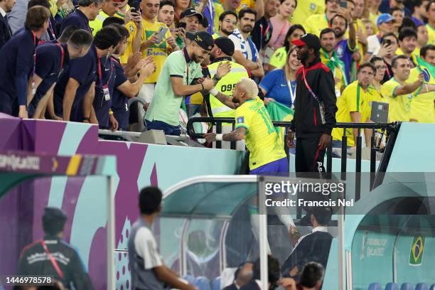 Neymar of Brazil celebrates the team's second goal with Alex Telles during the FIFA World Cup Qatar 2022 Round of 16 match between Brazil and South...