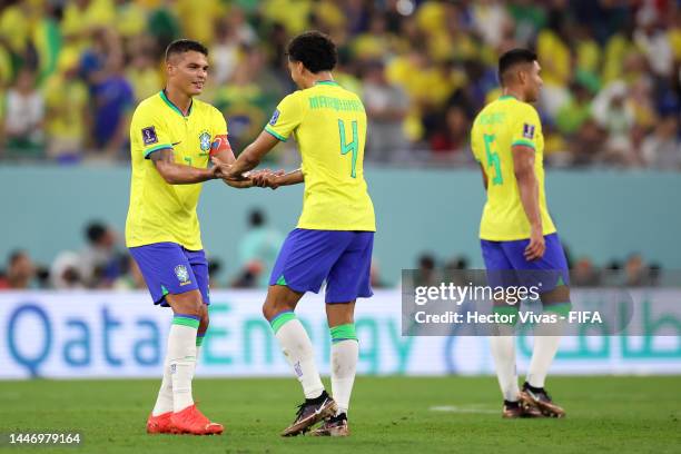 Thiago Silva and Marquinhos of Brazil celebrate after their sides third goal during the FIFA World Cup Qatar 2022 Round of 16 match between Brazil...