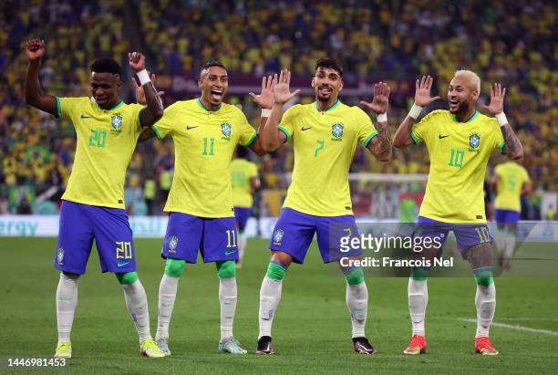Neymar of Brazil celebrates with Raphinha, Lucas Paqueta and Vinicius Junior after scoring the team's second goal via a penalty during the FIFA World...