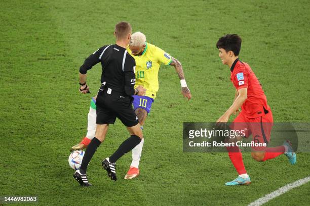 Referee Clement Turpin clashes with Neymar of Brazil during the FIFA World Cup Qatar 2022 Round of 16 match between Brazil and South Korea at Stadium...