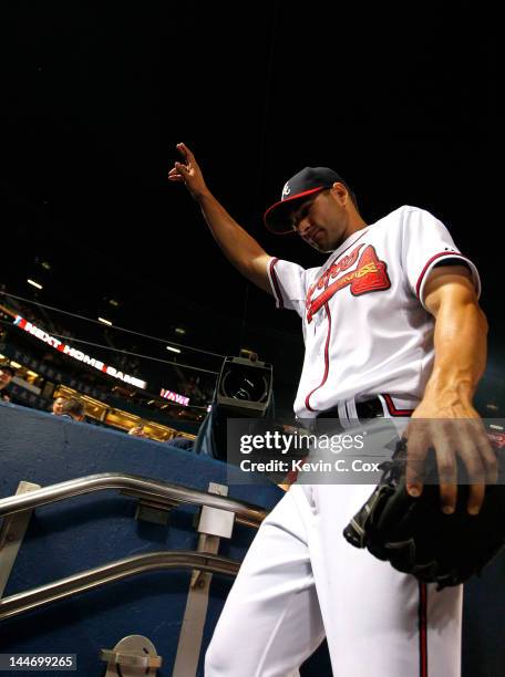 Brandon Beachy of the Atlanta Braves reacts after pitching a complete-game shutout to give the Braves a 7-0 win over the Miami Marlins at Turner...
