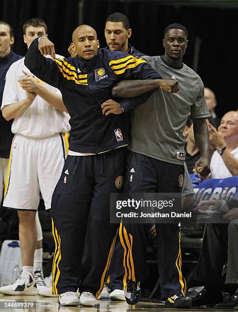 Dahntay Jones and Lance Stephenson of the Indiana Pacers lock arms as they watch their teammates take on the Miami Heat in Game Three of the Eastern...