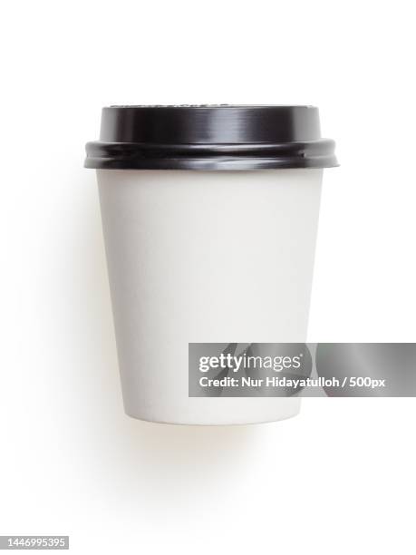 close-up of disposable cup against white background,indonesia - take away coffee cup stock pictures, royalty-free photos & images