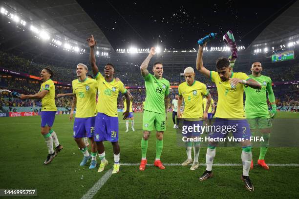 Pedro, Vinicius Junior, Ederson, Richarlison, Lucas Paqueta and Weverton of Brazil celebrate after the team's victory during the FIFA World Cup Qatar...