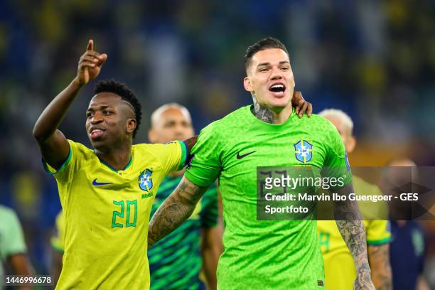 Vinicius Junior of Brazil celebrates with Ederson after the FIFA World Cup Qatar 2022 Round of 16 match between Brazil and South Korea at Stadium 974...