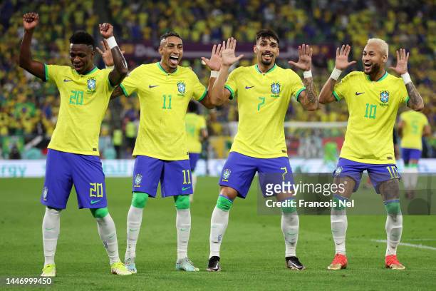 Neymar of Brazil celebrates with Raphinha, Lucas Paqueta and Vinicius Junior after scoring the team's second goal via a penalty during the FIFA World...