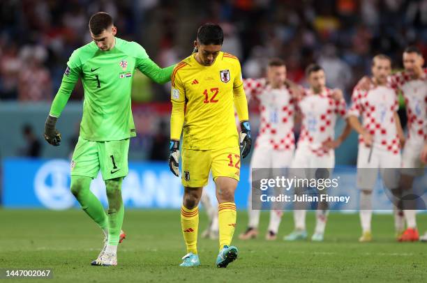 Keepers Shuichi Gonda of Japan and Dominik Livakovic of Croatia meet before the shoot out during the FIFA World Cup Qatar 2022 Round of 16 match...