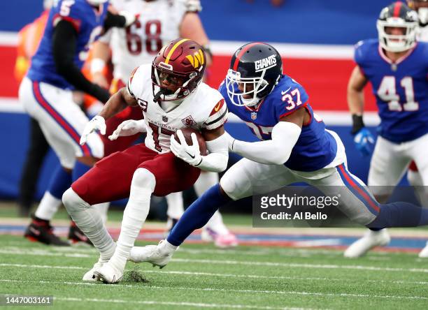 Terry McLaurin of the Washington Commanders runs after a catch against Fabian Moreau of the New York Giants during their game at MetLife Stadium on...
