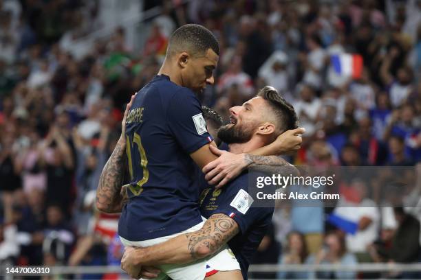 Olivier Giroud of France celebrates with teammates Kylian Mbappe after scoring the team's first goal during the FIFA World Cup Qatar 2022 Round of 16...