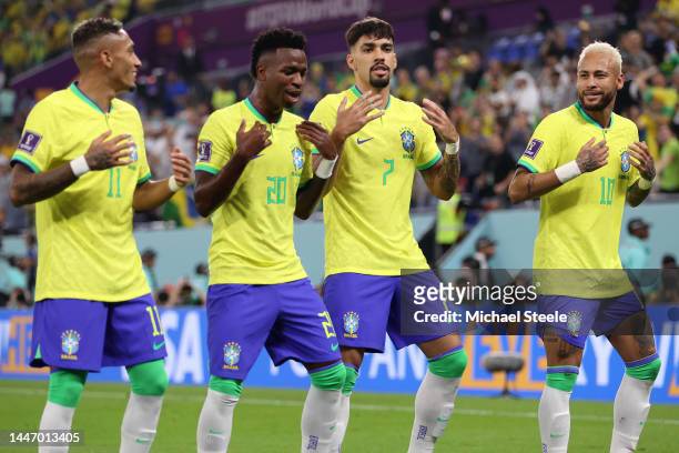 Vinicius Junior of Brazil celebrates with Raphinha, Lucas Paqueta and Neymar after scoring the team's first goal during the FIFA World Cup Qatar 2022...