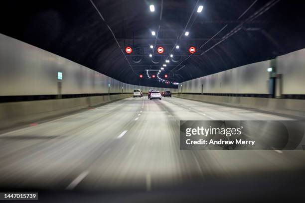 tunnel vision, driving on empty highway, speed motion - 車道トンネル ストックフォトと画像
