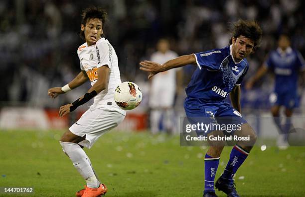 Emiliano Papa from Velez Sarfield and Neymar from Santos fight for the ball during a match between Velez Sarfield and Santos as part of the Copa...