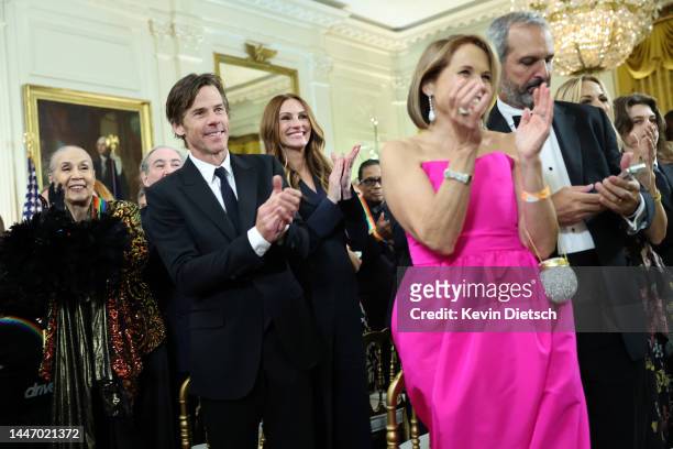 Cinematographer Daniel Moder, his wife actress Julia Roberts, journalist Katie Couric and her husband John Molner wait for U.S. President Joe Biden...