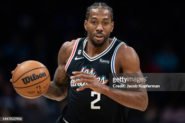 Kawhi Leonard of the LA Clippers brings the ball up court in the first quarter during their game against the Charlotte Hornets at Spectrum Center on...