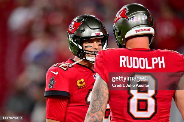 Tom Brady of the Tampa Bay Buccaneers talks with Kyle Rudolph prior to the game against the New Orleans Saints at Raymond James Stadium on December...