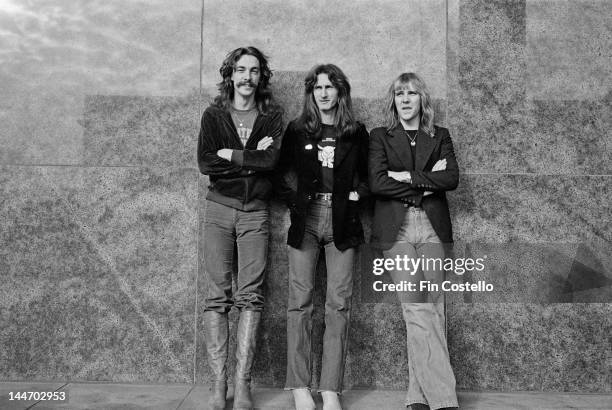 17th DECEMBER: Drummer Neil Peart, Bassist Geddy Lee and Guitarist Alex Lifeson from Canadian progressive rock band Rush posed in Cleveland, Ohio on...