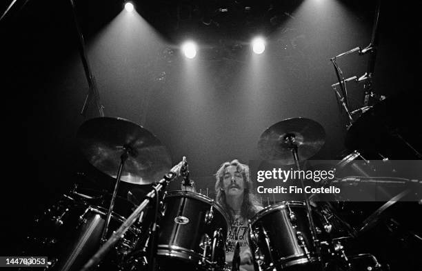 12th DECEMBER: Drummer Neil Peart of Canadian progressive rock band Rush, posed at his drum kit at a studio in Shepperton, Surrey on 12th December...