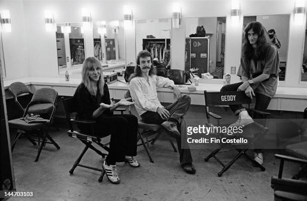 26th SEPTEMBER: Guitarist Alex Lifeson, drummer Neil Peart and bassist Geddy Lee from Canadian progressive rock band Rush pose backstage at the Civic...