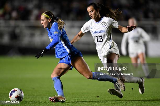 Quincy McMahon of the UCLA Bruins dribbles against Isabel Cox of the North Carolina Tar Heels in the second half during the Division I Women’s Soccer...