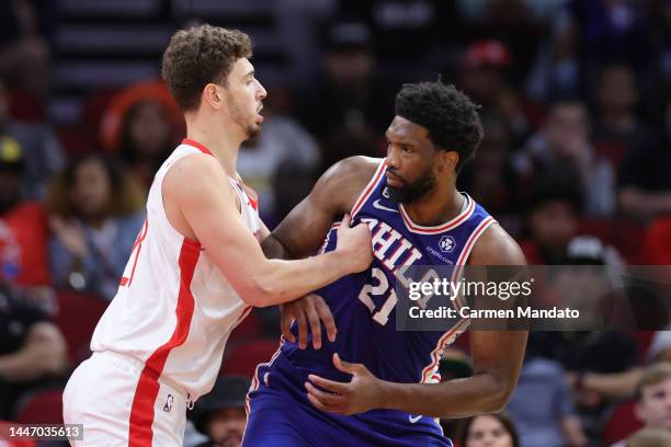 Joel Embiid of the Philadelphia 76ers is defended by Alperen Sengun of the Houston Rockets during the first half at Toyota Center on December 05,...