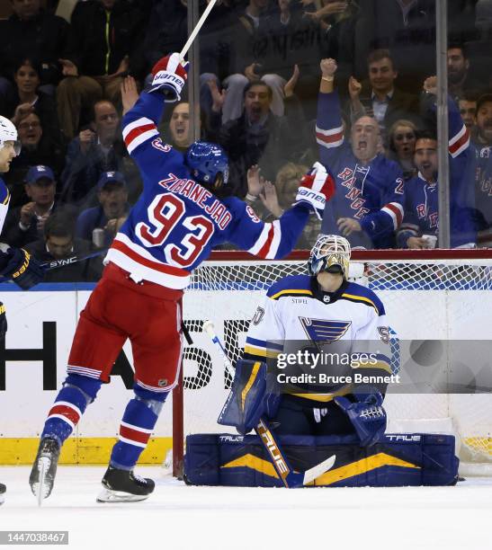 Mika Zibanejad of the New York Rangers celebrates the game winning goal by Alexis Lafreniere against Jordan Binnington of the St. Louis Blues at...