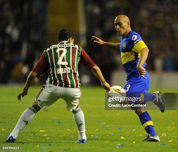 Clemente Rodriguez of Boca and Bruno of Fluminense fight for the ball during a match between Boca and Fluminense as part of the 2012 Copa...