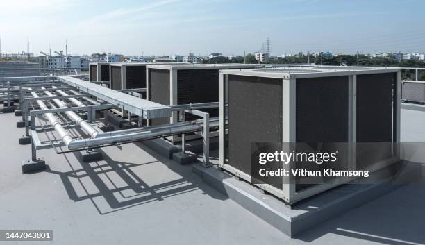 air compressor at rooftop of industrial factory - gaskompressor stock-fotos und bilder