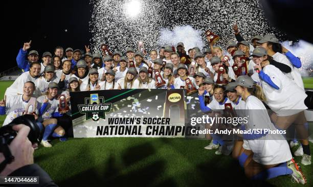 Bruins players and coaches celebrate after winning the 2020 Women's College Cup Final between North Carolina and UCLA at Sahlen's Stadium at WakeMed...