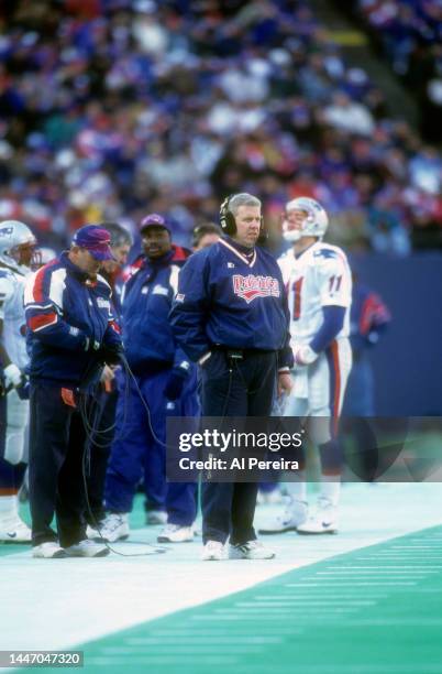 Head Coach Bill Parcells of the New England Patriots follows the action during the game between the New England Patriots vs the New York Giants at...